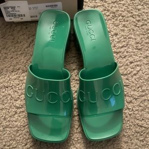 Women’s Gucci rubber slide sandals